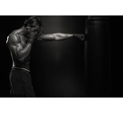 Mma Fighter Practicing Boxing Bag Wall Mural