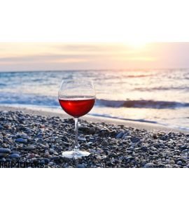 Romantic glass of wine sitting on the beach Wall Mural Wall art Wall decor